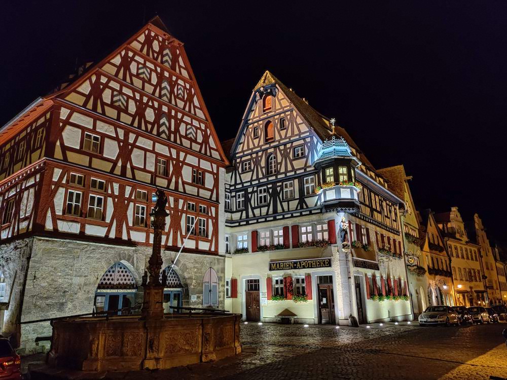 Half-timbered buildings lit up at night